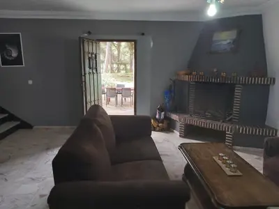 a living room with a couch and a fireplace at Casa Selene in El Puerto de Santa María