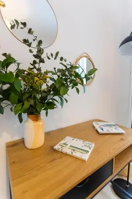 a table with a vase with a plant on it at ENTREARCOS in Cádiz