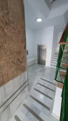a room with a staircase and a glass wall at APARTAMENTO A PIE DE PLAYA. in Cádiz