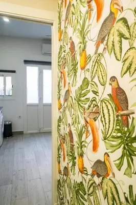 a wall with a mural of birds and plants at R&B Puerto Sherry Abohem in El Puerto de Santa María