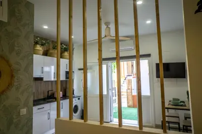 a kitchen with a large window in a room at R&B Puerto Sherry Abohem in El Puerto de Santa María