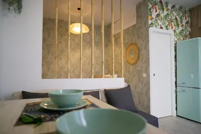 a dining room with a table with a bowl on it at R&B Puerto Sherry Abohem in El Puerto de Santa María