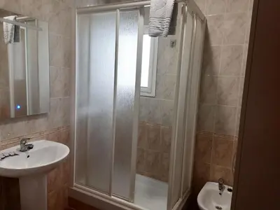 a bathroom with a shower and a sink at El Cano Playa Victoria Grupo AC Gestion in Cádiz
