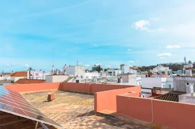 a view of a city from the roof of a building at Ático Imperial GARAJE GRATIS Céntrico Terraza Aire Acond Solarium 2 baños wifi a 1minuto de la Plaza Cabildo in Sanlúcar de Barrameda