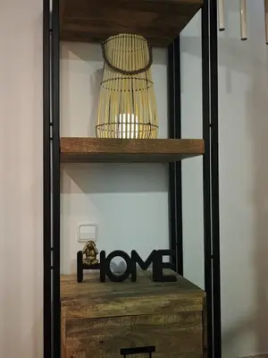 a wooden shelf with a bird cage on it at La Terraza de Gades Little Apartments in Cádiz