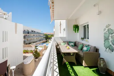 an apartment balcony with a view of a pool at BRISAMAR Rota ATLÁNTICO apartment in Rota