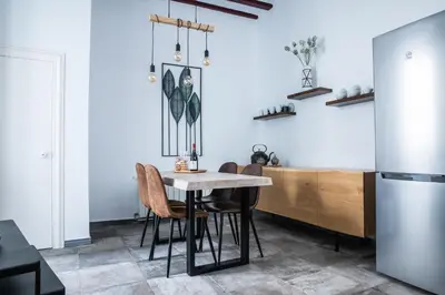 a dining room with a table and chairs at Casa del Sur in Cádiz