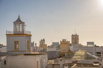 a view of a city with a clock tower at Casa del Sur in Cádiz