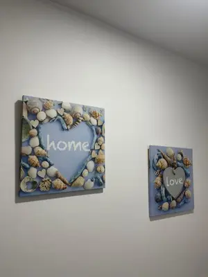 a picture of a heart made of shells and the words home at apartamentos Bandera in Jerez de la Frontera