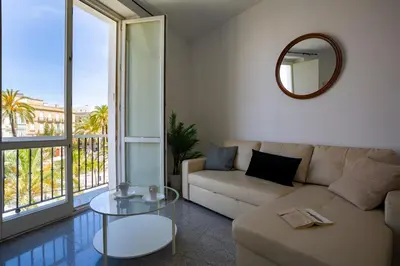 a living room with a couch and a glass table at Apartamentos El Capitan Veneno by Cadiz4Rentals in Cádiz