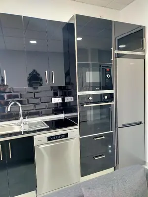 a kitchen with a sink and a refrigerator at María y Juan Apartamento con Garaje in Sanlúcar de Barrameda