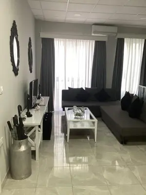 a living room with a couch and a table at María y Juan Apartamento con Garaje in Sanlúcar de Barrameda