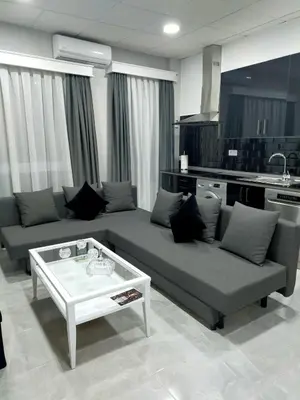 a living room with a couch and a coffee table at María y Juan Apartamento con Garaje in Sanlúcar de Barrameda