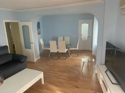 a living room with a couch and a table at Cádiz San Pedro in Cádiz
