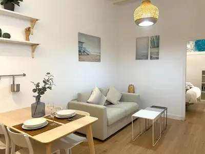 a living room with a couch and a table at El Aljibe de Botica in Cádiz