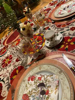 a table with plates and dishes on top of it at Casa Palacio Ánima in Jerez de la Frontera