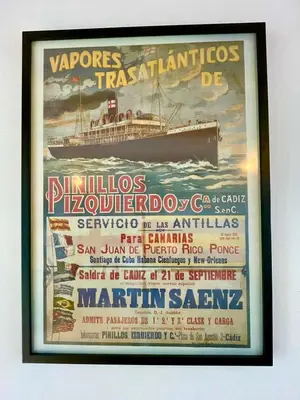 a framed poster of a ship on the water at GATU PREMIUM Villa Galeona, con terraza privada chillout in Cádiz
