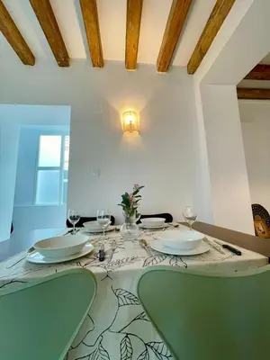 a table with two chairs and a table with glasses at GATU PREMIUM Villa Galeona, con terraza privada chillout in Cádiz