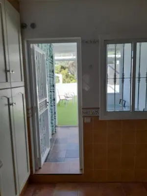 an open door to a room with a view of a patio at La casa de la luz in San Fernando