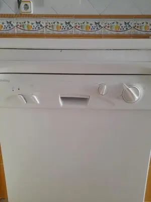 a close up of a white stove top oven at La casa de la luz in San Fernando