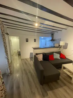 a living room with a couch and a table at Estudio Las Flores by Cadiz Time in Cádiz
