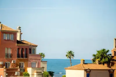 a view of houses and the ocean at Atico BLUE Beach in El Puerto de Santa María