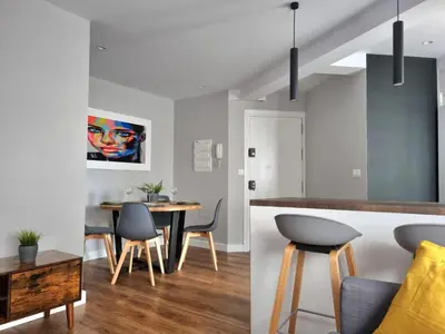 a kitchen and dining room with a table and chairs at Aujada playa in Cádiz