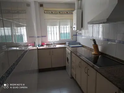 a kitchen with a sink and a counter top at ALQUILER CHIPIONA in Chipiona