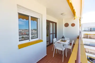 a room with a table and chairs and a window at Mirador del Guadalquivir in Sanlúcar de Barrameda
