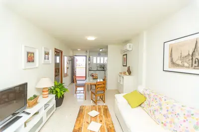 a living room with a couch and a table at Mirador del Guadalquivir in Sanlúcar de Barrameda