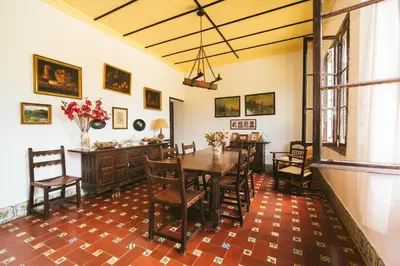 a dining room with a table and chairs at Villa La Jara Sanlúcar in Sanlúcar de Barrameda