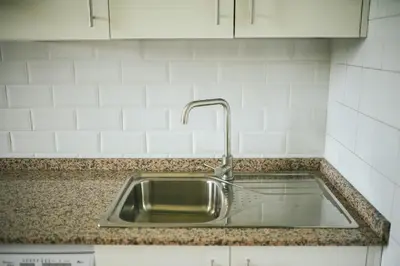a kitchen sink with a faucet on a counter at Villa La Jara Sanlúcar in Sanlúcar de Barrameda
