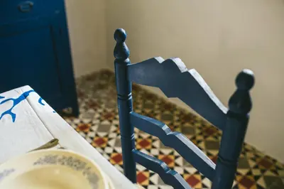 a bed with a blue frame and a plate of food at Villa La Jara Sanlúcar in Sanlúcar de Barrameda