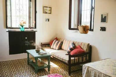 a living room with a couch and a table at Villa La Jara Sanlúcar in Sanlúcar de Barrameda