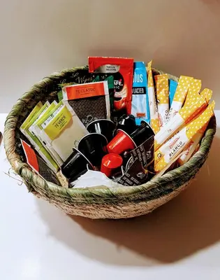 a basket filled with food and snacks on a table at el 2 de Flamenco BajoB in Cádiz