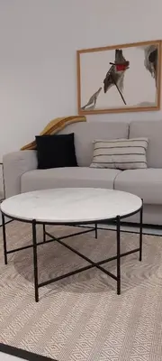 a white coffee table in front of a couch at el 2 de Flamenco 1ºB in Cádiz
