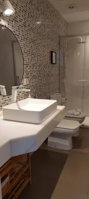 a bathroom with a sink and a toilet and a mirror at el 2 de Flamenco 1ºB in Cádiz