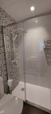 a shower with a glass door in a bathroom at el 2 de Flamenco 1ºB in Cádiz