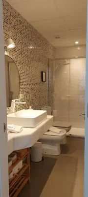 a bathroom with a sink and a toilet and a mirror at el 2 de Flamenco 1ºB in Cádiz