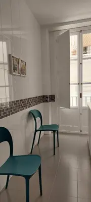 a room with two chairs and a window at el 2 de Flamenco 2ºB in Cádiz