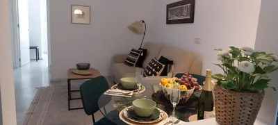 a living room with a table with a bowl of fruit at el 2 de Flamenco 1ºA in Cádiz