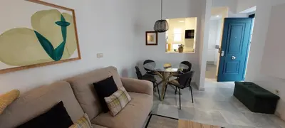 a living room with a couch and a table at el 2 de Flamenco 2ºA in Cádiz