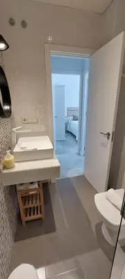 a bathroom with a sink and a toilet at el 2 de Flamenco 2ºA in Cádiz