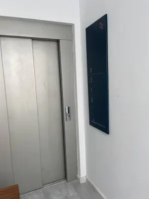 two doors in a room with a sign on the wall at el 2 de Flamenco Ático 3ºB in Cádiz