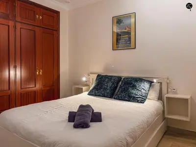 a bedroom with a bed with two pillows on it at Dolce Vita en la Caleta Grupo AC Gestion in Cádiz