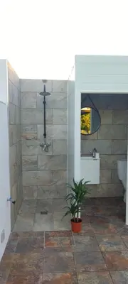 a bathroom with a shower with a toilet and a sink at Chalet Hercules la barrosa in Chiclana de la Frontera