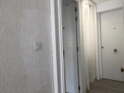 a room with a door and a closet with a door at Torredelfino in Jerez de la Frontera
