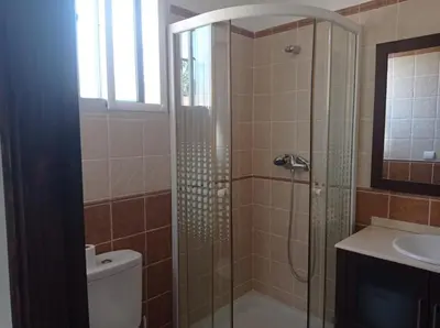 a bathroom with a shower and a toilet and a sink at El Vaivén in El Puerto de Santa María