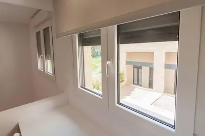 a window in a room with a view of a building at El Duplex de Barrocal in Cádiz