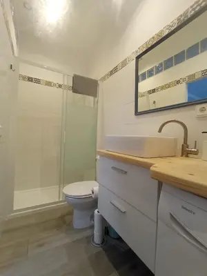 a bathroom with a sink and a toilet and a shower at Casa Reyes in Rota